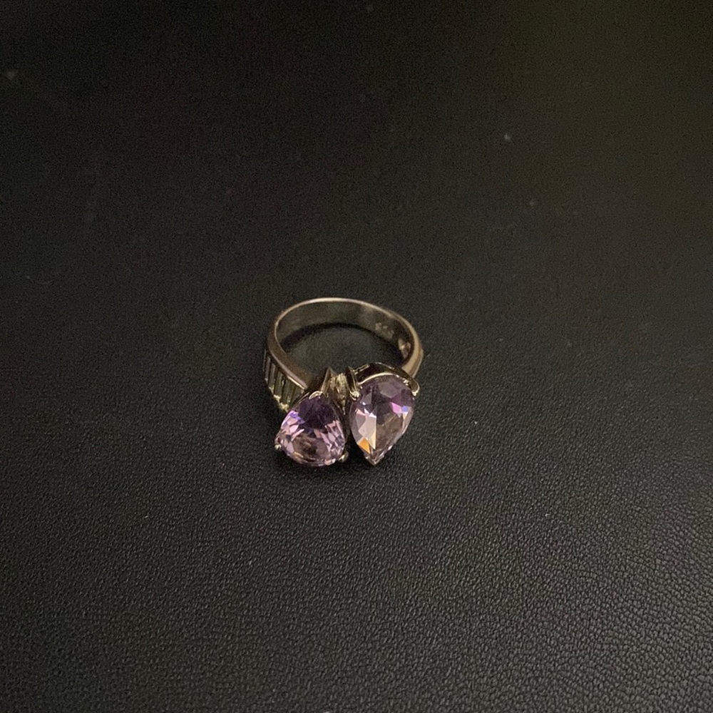 Metal ring with purple stones